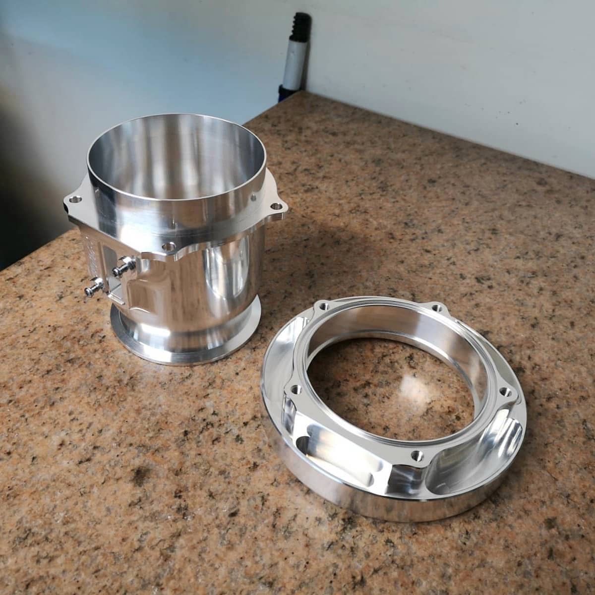 Turned and milled housing