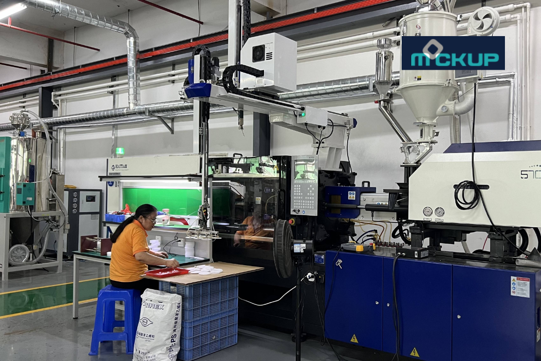 Injection molding machine with material handling equipment